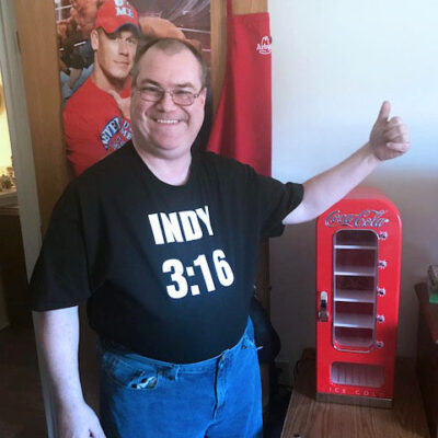 A man gives a thumbs up for his pop dispenser