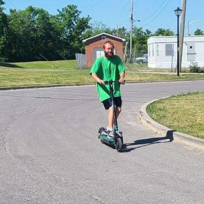 Extreme Dreamers2 Man riding a scooter