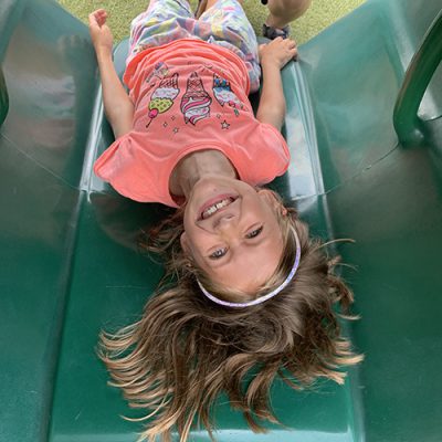 girl in tunnel Upside down view of girl in playground tunnel