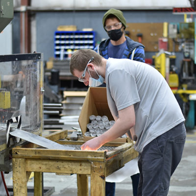 A man sorts through parts